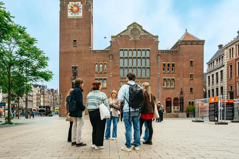 Amsterdam: Cultural Highlights Walking Tour - Returning along the Amstel and finishing at the monument