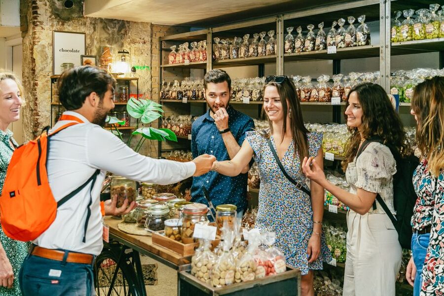 Amsterdam: Historical Highlights Walking Tour with Tasting - Following the canals through medieval and Golden Age Amsterdam