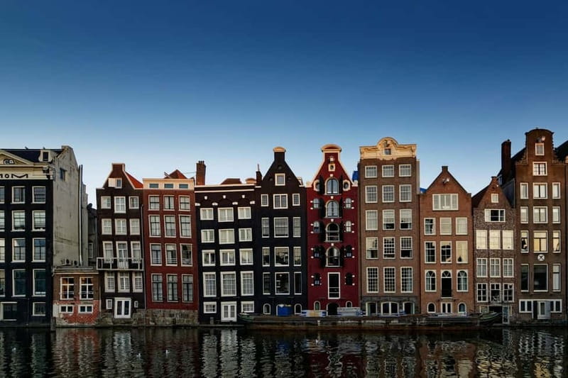 Amsterdam: Iconic Canals & Historic Sights Walking Tour - Oude Kerk at the heart of the Red Light District