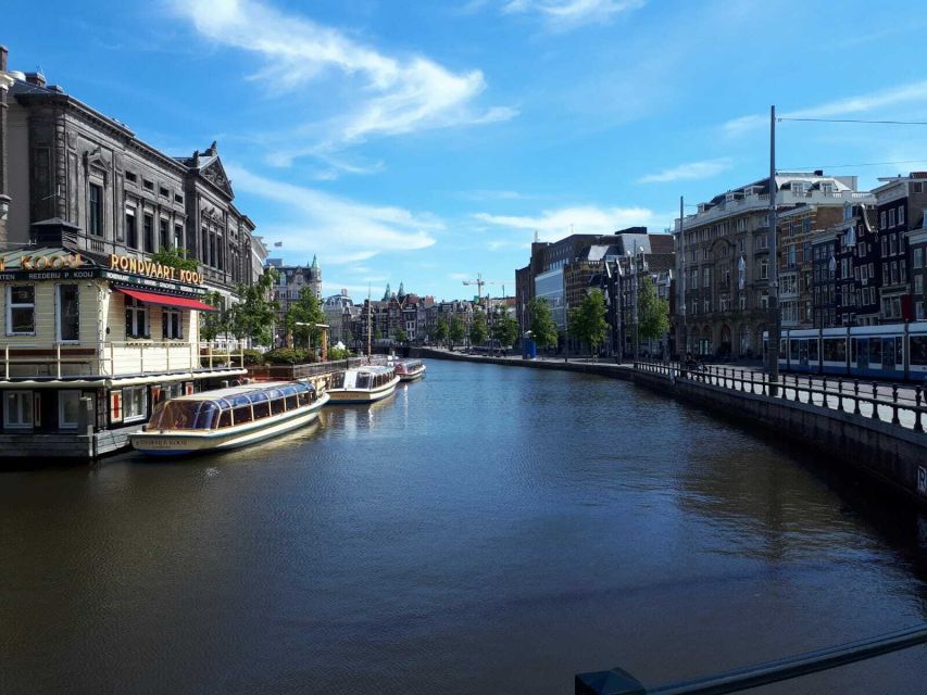 Amsterdam Walking Tour and Canal Cruise - A street market brings local life into the route