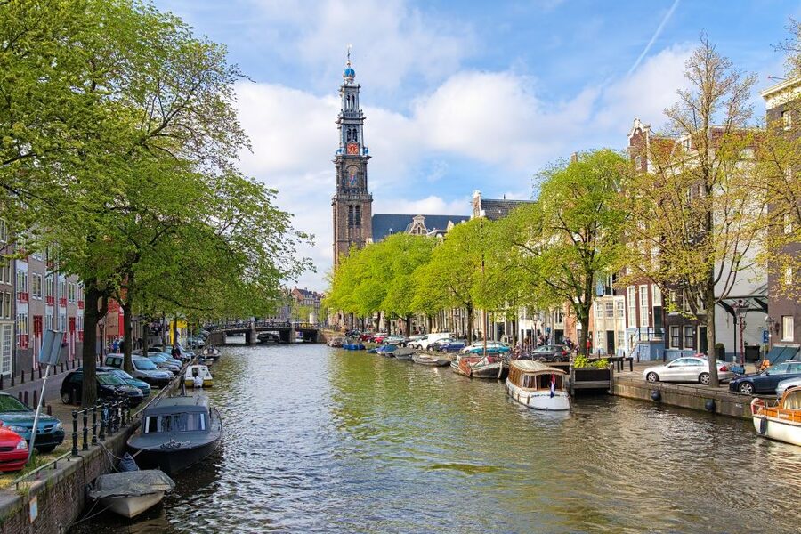 Amsterdam Walking Tour and Canal Cruise - Dam Square sets the historical frame
