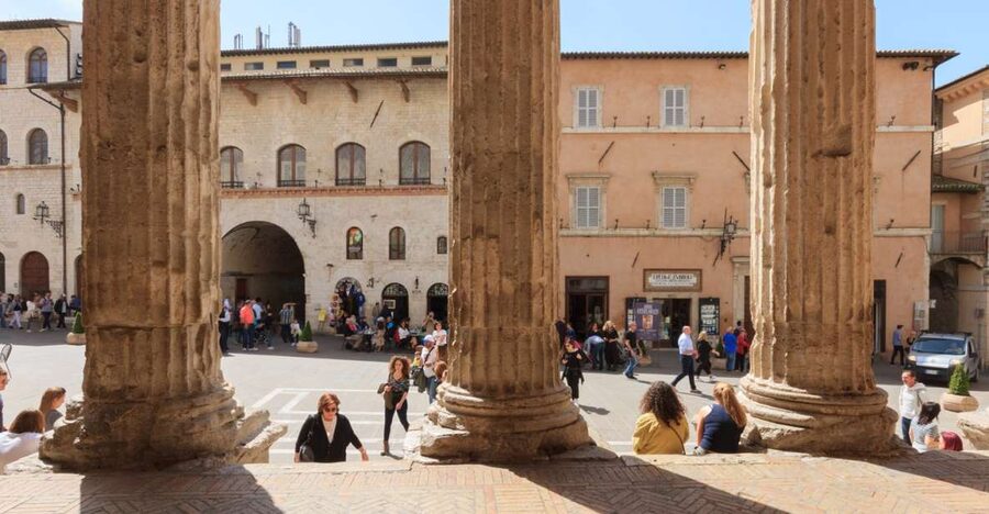 Assisi: Old Town Guided Walking Tour - Roman columns beside a Christian church