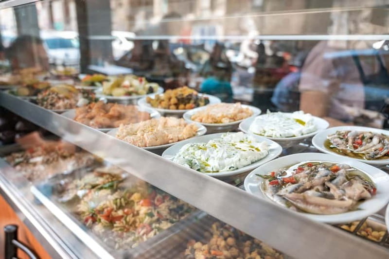 Athens: Guided Greek Food Walking Tour with Tastings - Walking through Varvakios Agora’s meat and fish markets
