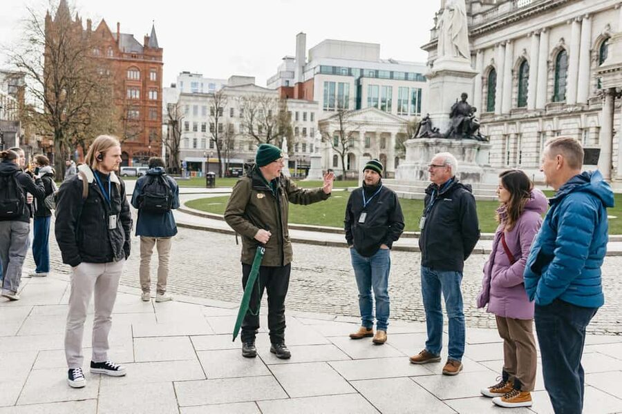 Belfast: The Troubles Walls & Bridges Guided Walking Tour - Walking toward Divis and the Falls area