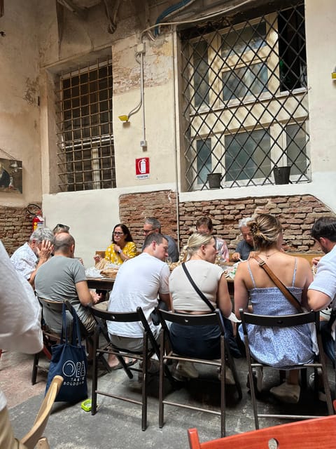 Bologna: Walking Food Tour and Highlights with a Local Guide - Mortadella, bread, and a glass of wine