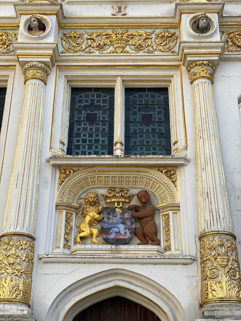 Bruges Guided Walking Tour: Stories, Mysteries and People - Fish Market, Huidenvettersplein, and the canal views