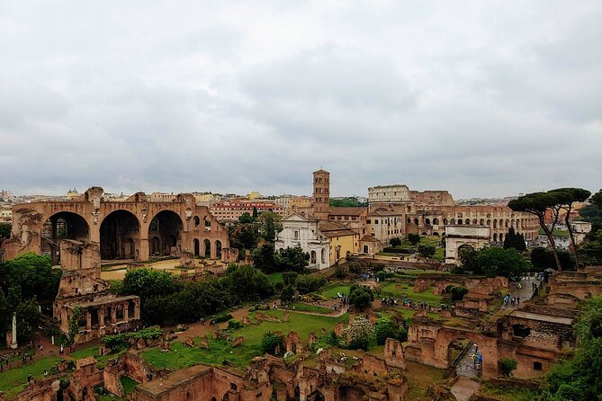 Colosseum & Ancient Rome Guided Walking Tour - Walking through the Roman Forum