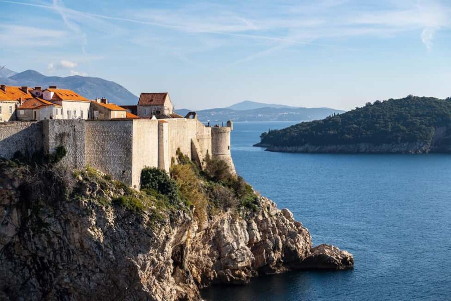 Dubrovnik: City Walls, Old Town Walking Tour & Adriatic View - Churches, the synagogue, and a city rebuilt more than once