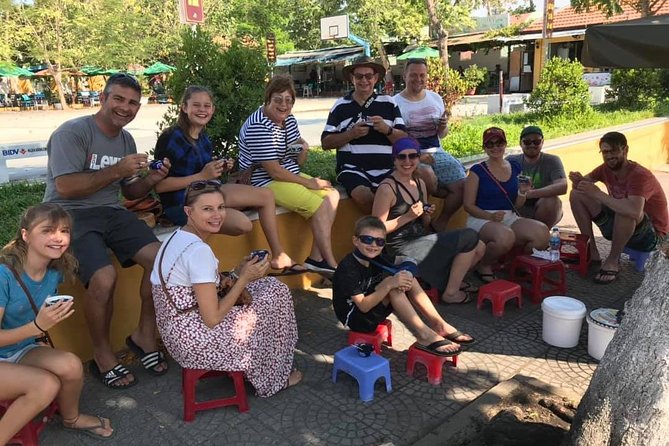 Evening Walking Food Tour, folk game and lantern boat - Walking through the Ancient Town