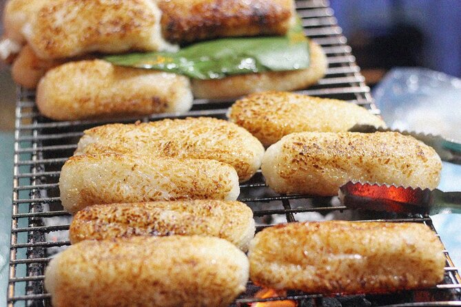 Ho Chi Minh City Street Food Tour & Sightseeing By Motorbike - Cambodian Market and banana or coconut crackers