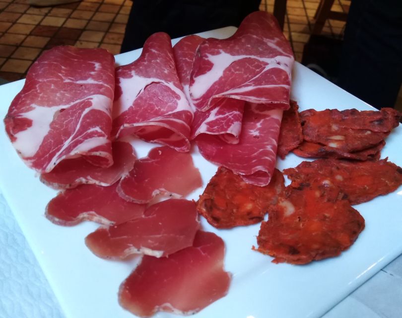 Lake Como: Food Walking Tour - First stop: wine, cured meats, and a proper beginning