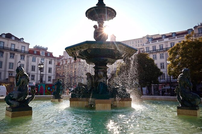 Lisbon Food Tour with 10+ Tastings of Local Delicacies & Wines - Baixa, the Santa Justa Lift, and a lesson in city design