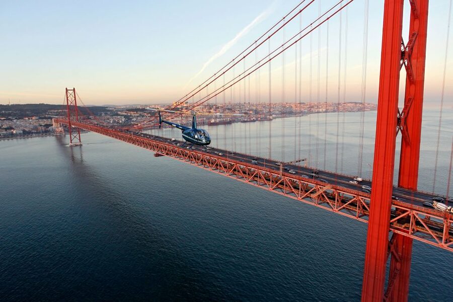 Lisbon: Helicopter Ride, Boat Trip, & Old Town Walking Tour - Guides, language, and group rhythm