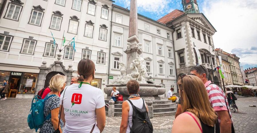 Ljubljana: Slovenian Cuisine Walking Tour with Tastings - Meeting the tour beside the Triple Bridge