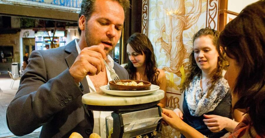 Madrid: Tapas & Wine Tasting Tour with Local Guide - Four old bars, twelve tapas, and a useful look at Madrid