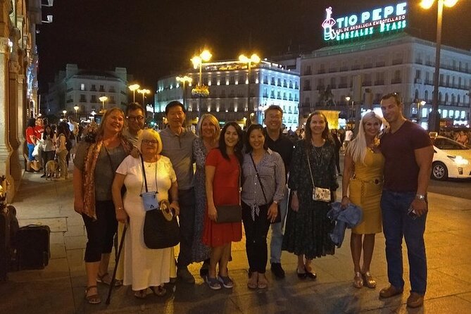Madrid Tapas & Wine Tasting Walking Tour – Small Group Local Bars - Calle de las Huertas and the wine shop behind the bottles