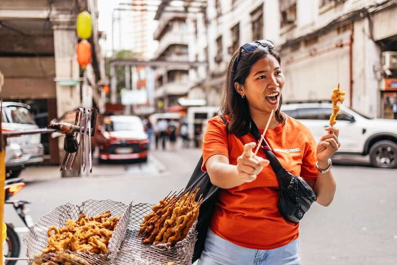 Manila: Street Food and Drinks Walking Tour with Tastings - Walking through Manila with a local guide