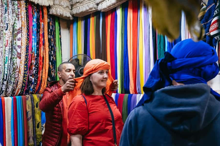 Marrakech: Ben Youssef, Secret Garden, & Souks Walking Tour - Guides, pace, and group experience