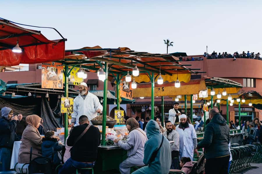 Marrakech: Medina by Night Walking Tour with Moroccan Tea - A rooftop ending with mint tea