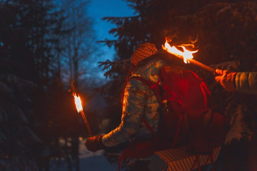 Oslo: Snowy Forest Torchlight Walk with Campfire - A campfire beside frozen Øvresetertjern Lake