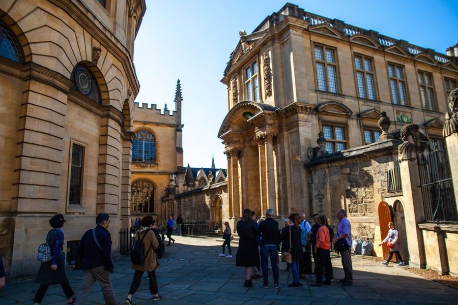 Oxford: University and City Walking Tour with Alumni Guide - Entering an Oxford college