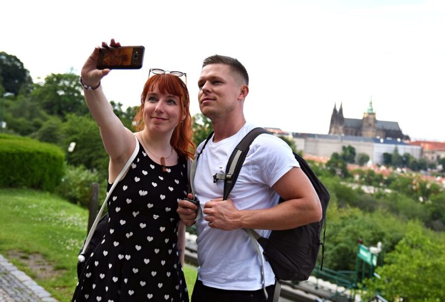 Panoramic Views of Prague Evening Walking Tour - Prague Castle glowing above Charles Bridge
