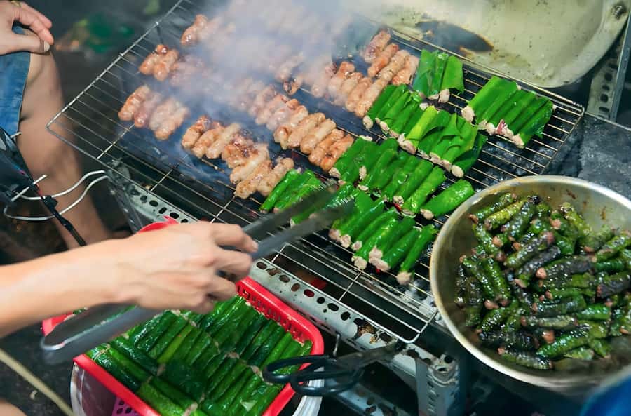 Saigon: Private Backstreets Walking Food Tour - Grilled banana and the first taste of Saigon’s sweet side