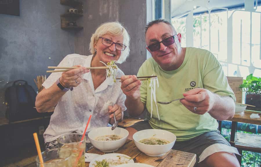 Saigon: Private Backstreets Walking Food Tour - The market stretch: betel leaf, rolls, and grilled seafood