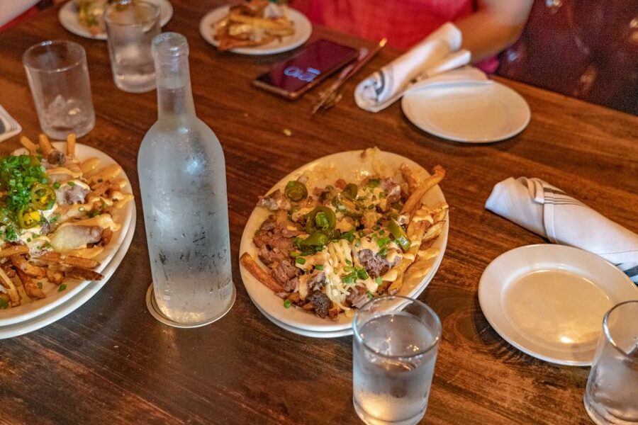 San Antonio: Historic Downtown Food and Culture Walking Tour - Texas comfort food at a long wooden bar
