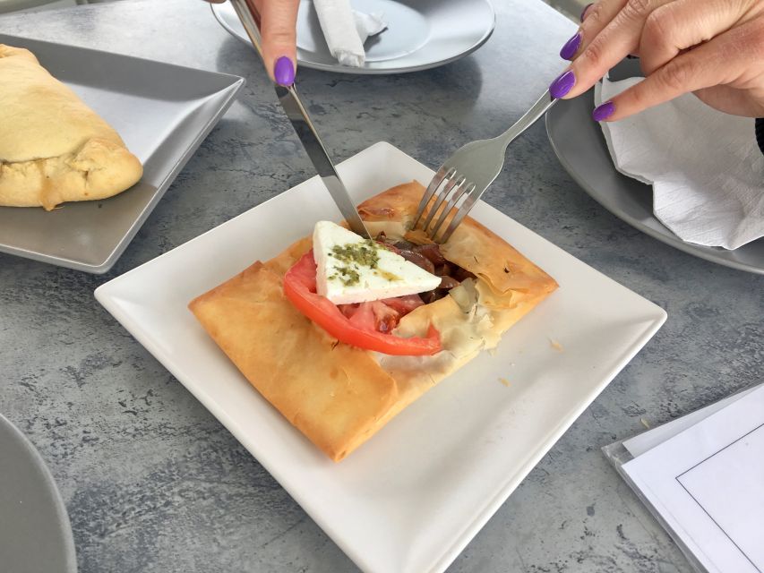 Santorini: Sunset Walking Tour with Local Food and Drinks - Restaurant stops with different moods