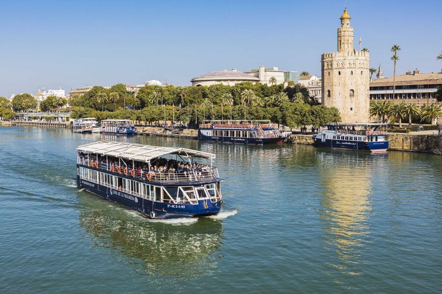 Seville: Panoramic Cruise, Hop-On-Hop-Off Bus & Walking Tour - Torre del Oro and the first bus ride