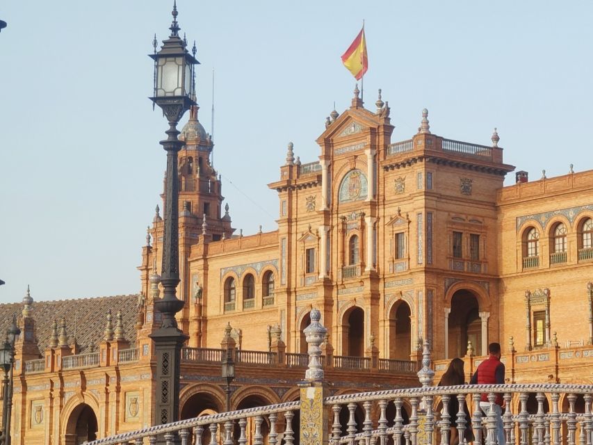 Seville: Small-Group City Highlights Walking Tour - Torre del Oro beside the river