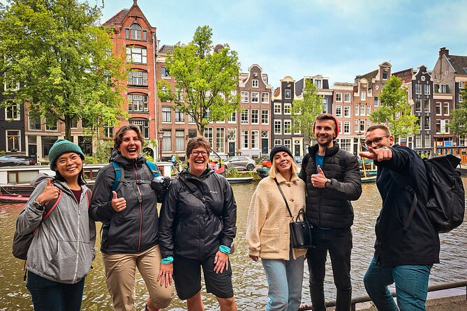Small Group Walking Tour - Hello Amsterdam - Damrak mixes canal views with a playful quiz