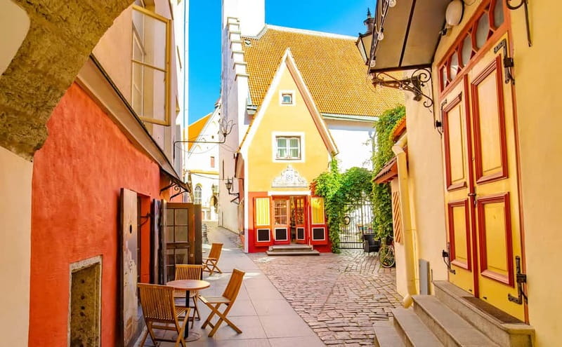 Tallinn Old Town: Stories and Views 2‑Hour Walking Tour - Lower Town stories at St Nicholas Church and Town Hall Square