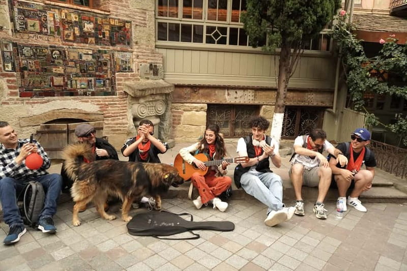 Tbilisi: Evening Walking Tour with Wine & Boat Ride Options - The Clock Tower and Tbilisi’s playful side