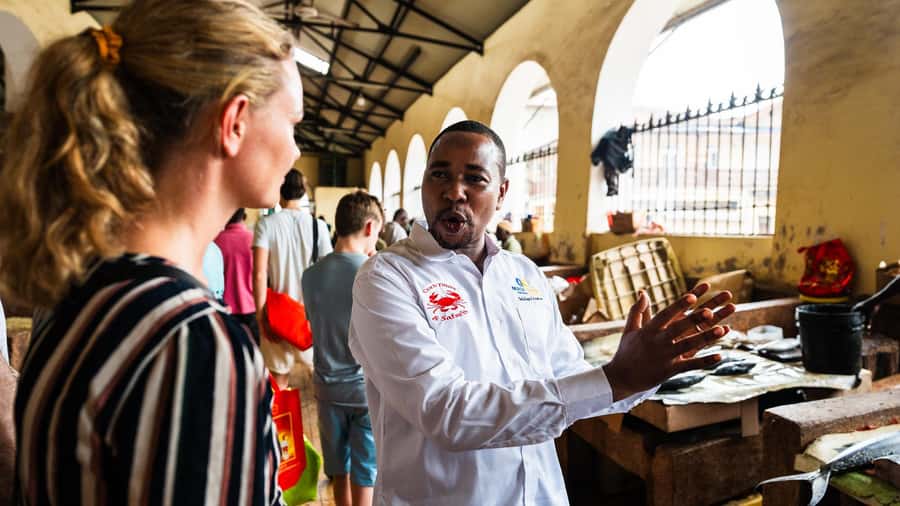 Zanzibar: Stone Town Historical Cultural Walking Guided Tour - Darajani Market shows Stone Town at work
